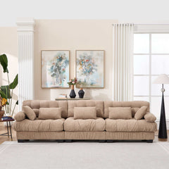 Modern light brown modular sectional sofa with deep seats and five throw pillows in living room setting