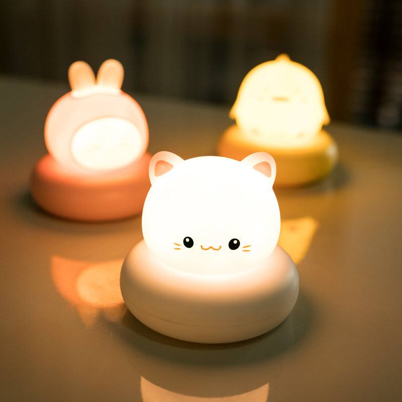 Modern LED desk lamp with cute pet night light design in pink vinyl shade for bedside decoration